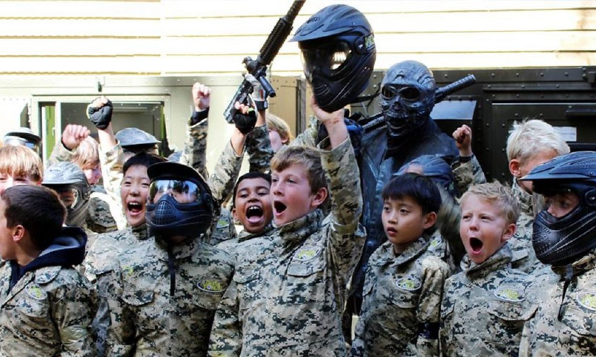 Young miniball players in paintball equipment